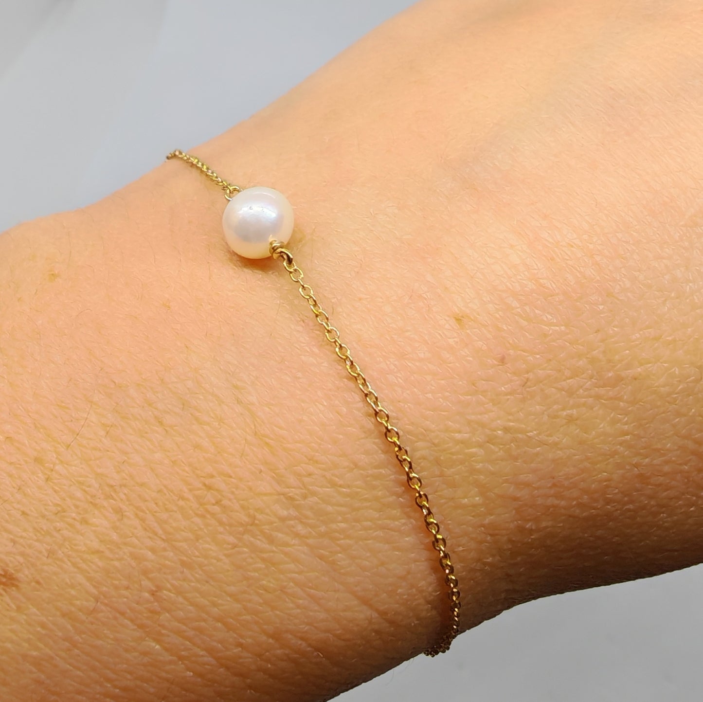 Bracciale in oro giallo 18 kt e perla