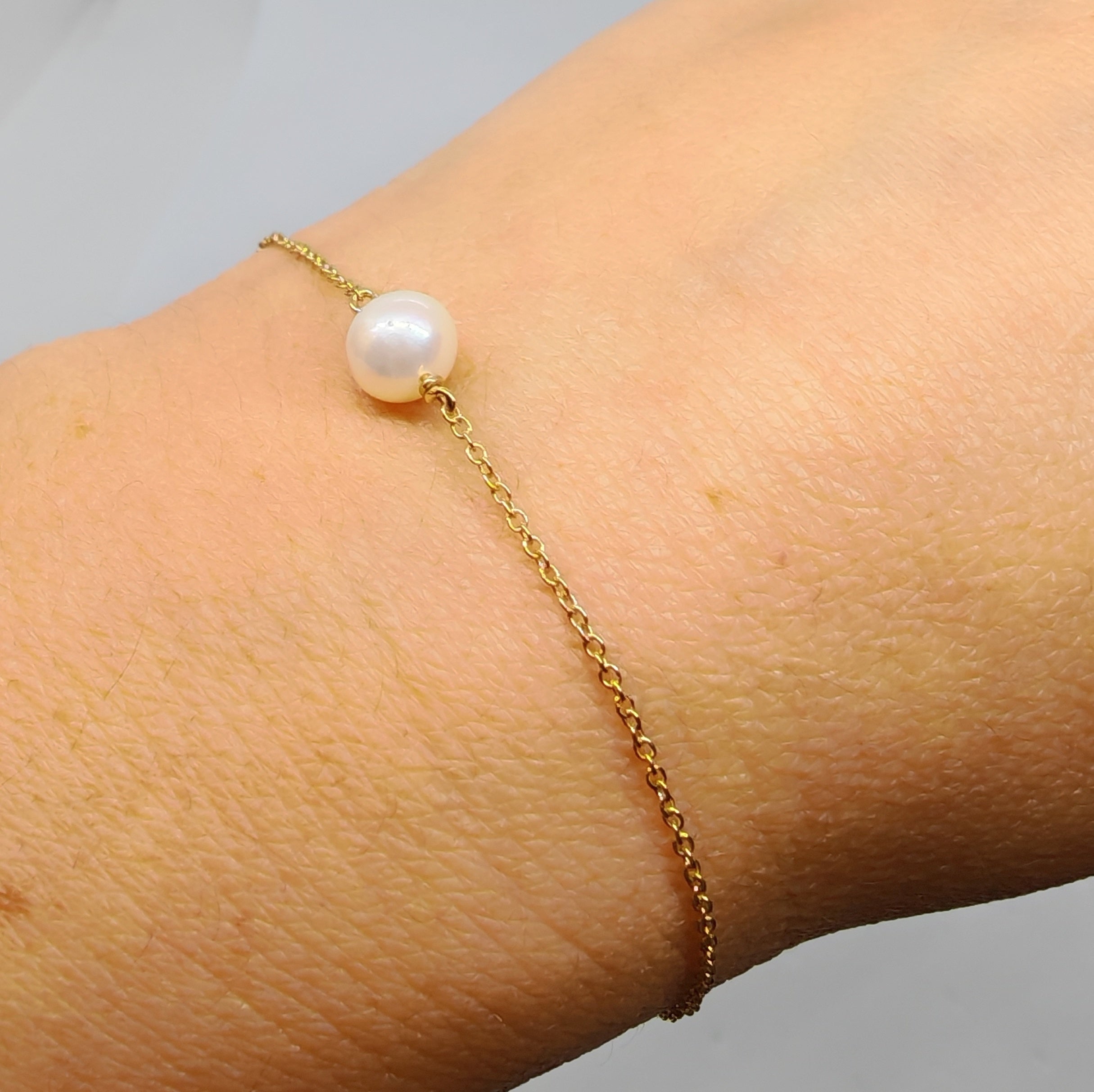Bracciale in oro giallo 18 kt e perla